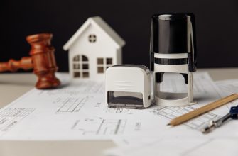 judge wooden gavel stamp model house with blueprint